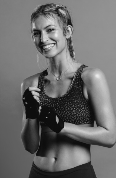 Gameplan mortgage member in athletic clothing and smiling at the camera.