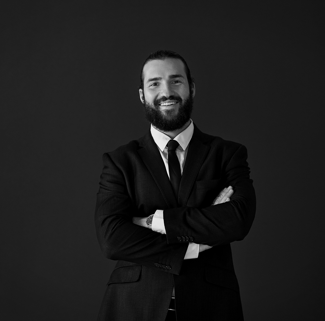 Gameplan business protection advisor crossing his arms and smiling at the camera.