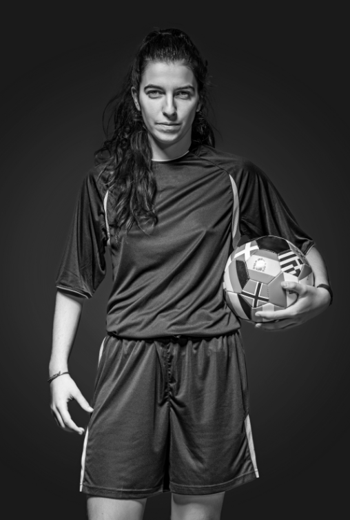 Gameplan member in football kit and looking into the camera.
